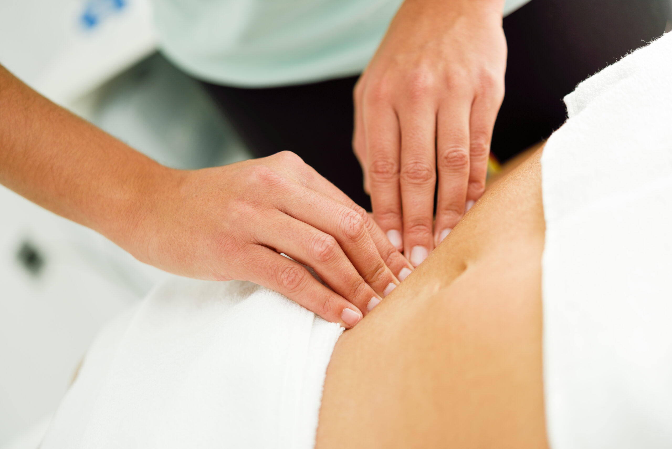 hands massaging female abdomen therapist applying pressure belly