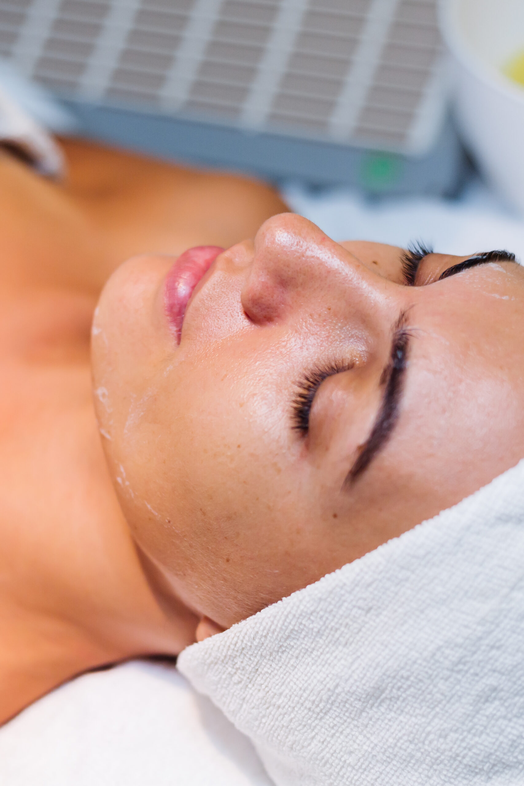 young woman lying cosmetologist s table rejuvenation procedure